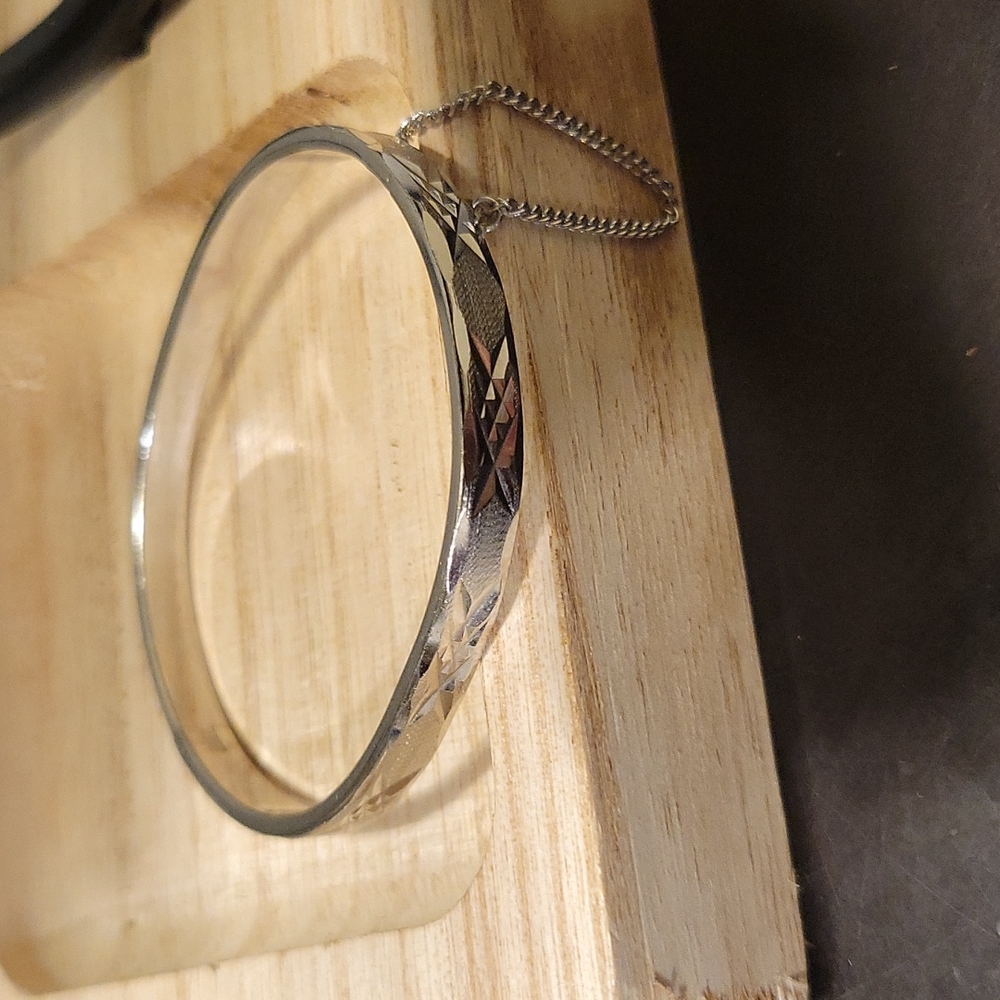 Pastelli Diamond Cut Silvertone Hinged Bangle Bracelet with Safety Chain